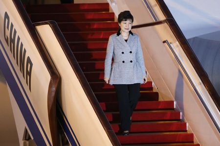 © Reuters. South Korean President Park arrives at Beijing Capital International Airport ahead of attending APEC meetings