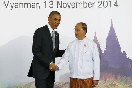 © Reuters. Obama and Sein shake hands before the EAS plenary session during the ASEAN Summit in Naypyitaw