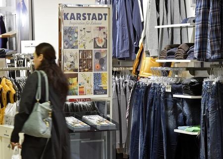 © Reuters. Shopper walks through Karstadt department store in Hamburg-Billstedt