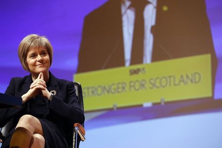 © Reuters. Newly elected party leader Nicola Sturgeon smiles at the Scottish Nationalist Party annual conference in Perth