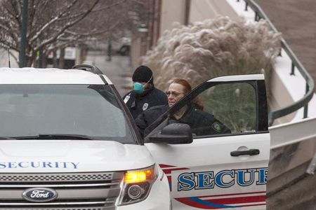 © Reuters. Security personnel prepare to escort the ambulance transporting Dr. Martin Salia at the Nebraska Medical Center in Omaha