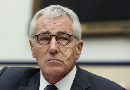 © Reuters. U.S. Secretary of Defense Chuck Hagel listens during his testimony at the House Armed Services Committee on Capitol Hill in Washington