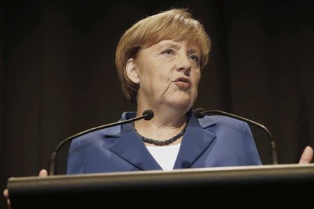 © Reuters. Merkel speaks at a news conference in Auckland