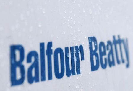 © Reuters. Raindrops are seen on a sign at a Balfour Beatty construction site in central London