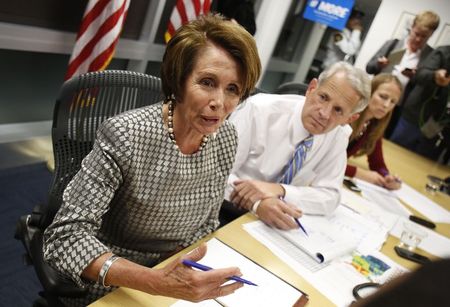 © Reuters. Nancy Pelosi (D-CA) and Steve Israel (D-NY) receive updates during midterm election day