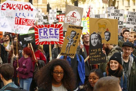 © Reuters. Demonstrators march along Whitehall as they participate in a protest against student loans and in favour of free education, in central London