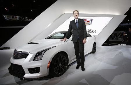 © Reuters. Cadillac President de Nysschen poses with the Cadillac ATS-V during the model's world debut at the Los Angeles Auto Show in Los Angeles