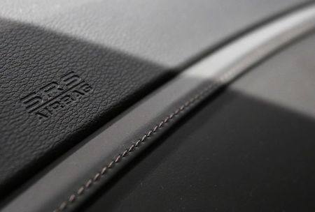 © Reuters. Logo of airbag is seen on passenger seat of Honda Motor Co's renewal hybrid sedan car "Legend", which installs airbag made by Takata Corp, during unveiling event in Tokyo