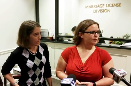 © Reuters. Jennifer Rose, a county government employee and Sara Meadows, a teacher, file a marriage license application in Charleston