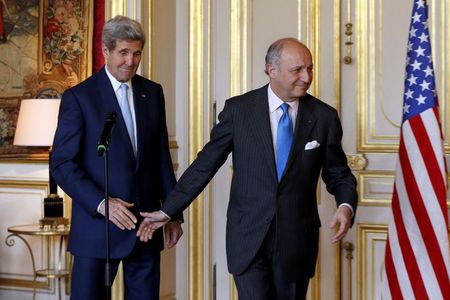 © Reuters. French Foreign Minister Laurent Fabius escorts US Secretary of State John Kerry after their talks and statement at the Quai d'Orsay Foreign Affairs ministry in Paris