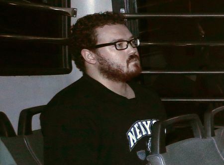 © Reuters. Jutting, a British banker charged with two counts of murder, sits in prison bus as he arrives at the Eastern Law Courts in Hong Kong