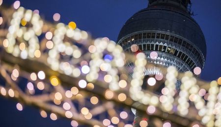 © Reuters. Christmas market decoration is pictured in front of the television tower in Berlin