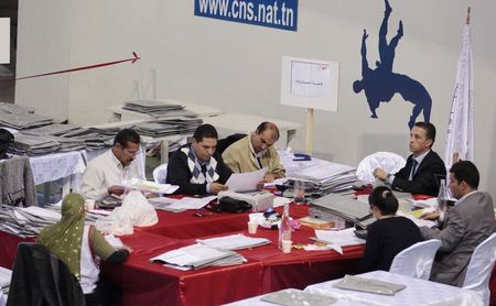 © Reuters. Election workers at a counting centre in Tunis