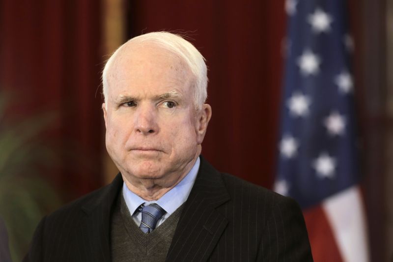 © Reuters. File photo of U.S. senator John McCain listening during a news conference in Riga