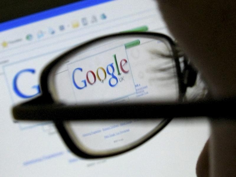 © Reuters. A Google search page is seen through the spectacles of a computer user in Leicester