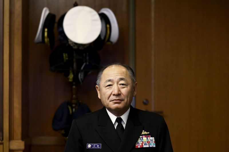© Reuters. Admiral Katsutoshi Kawano, chief of the Japanese Self-Defense Forces' Joint Staff, poses for pictures after an interview at the Japanese defense ministry in Tokyo