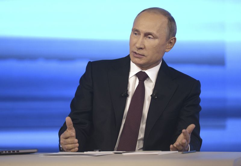 © Reuters. File photo of Russian President Vladimir Putin taking part in a live broadcast nationwide phone-in in Moscow