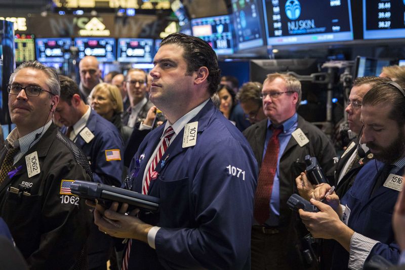 © Reuters. Traders work on the floor of the New York Stock Exchange shortly after the opening bell in New York