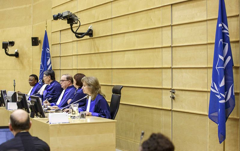 © Reuters. The judges for case against former Congolese warlord Lubanga sit in courtroom of ICC in The Hague