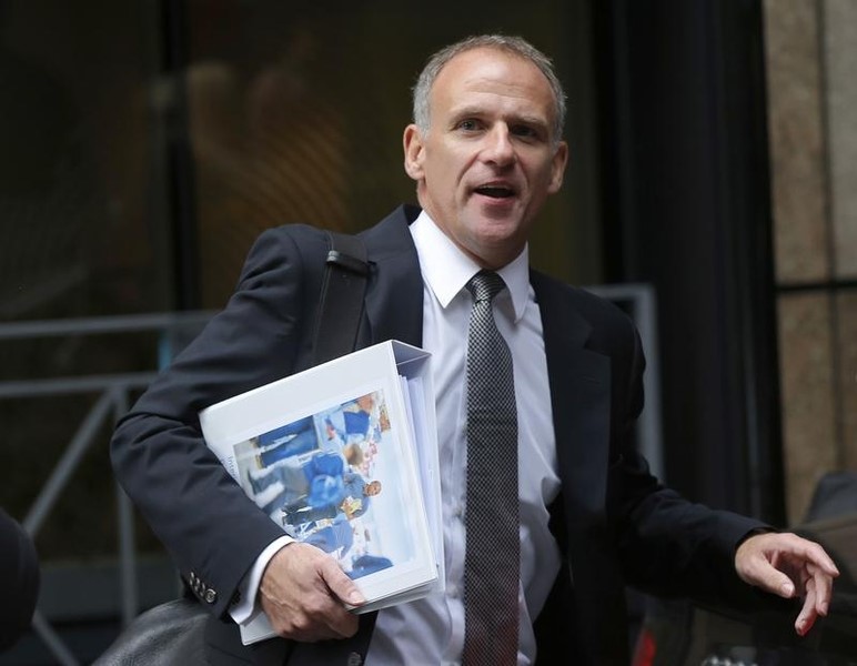 © Reuters. Tesco chief executive Dave Lewis leaves an office, after the announcement of the company's interim results, in the City of London