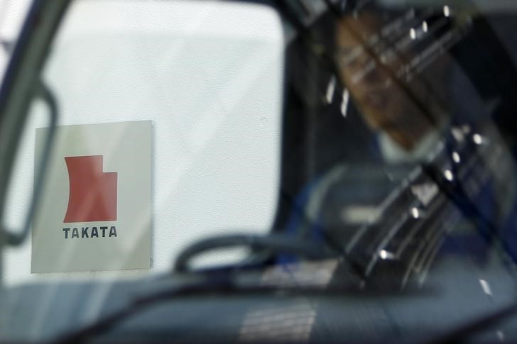 © Reuters. Logo of Takata Corp is seen through a car window outside the company's headquarter building in Tokyo