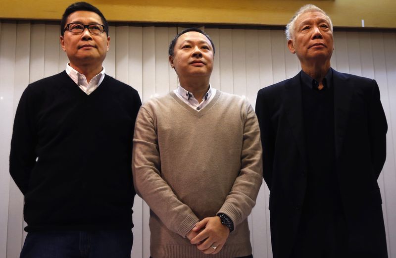 © Reuters. Occupy Central civil disobedience founders Chan, Tai and Reverend Chu attend a news conference on their voluntary surrender to the police in Hong Kong