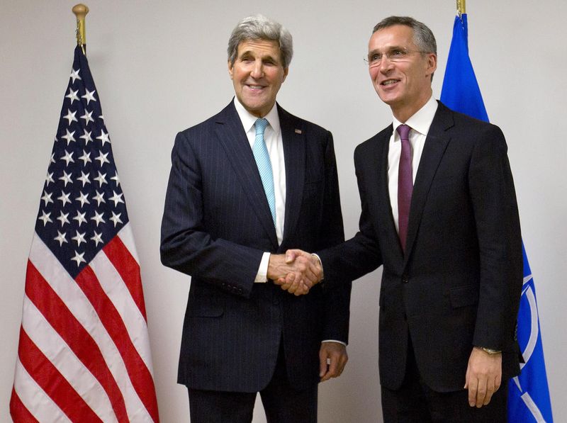 © Reuters. U.S. Secretary of State Kerry meets with NATO Secretary General Stoltenberg at the start of a NATO foreign ministers meeting in Brussels