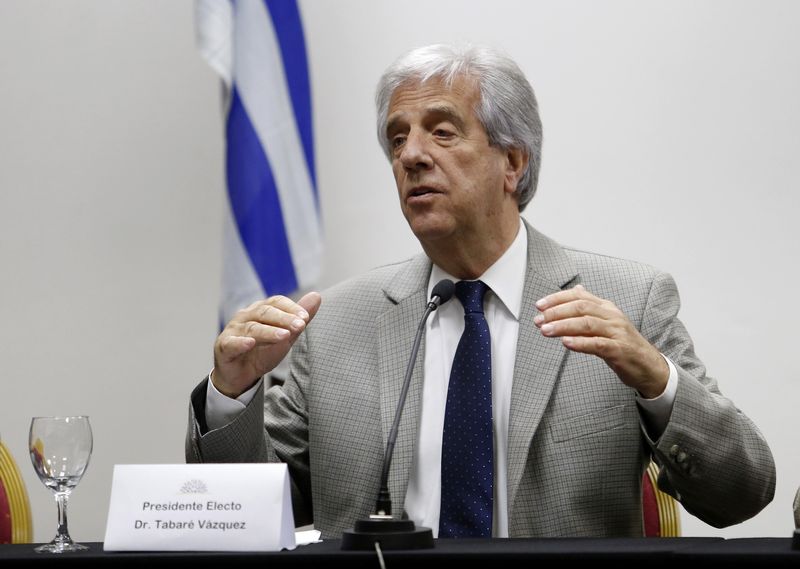 © Reuters. Newly elected Uruguayan President Vazquez gestures while announcing the ministers of his government at his office in Montevideo