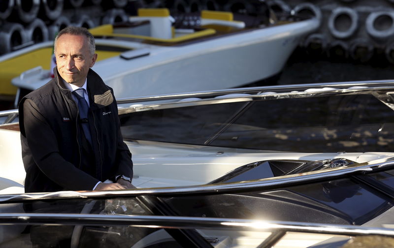© Reuters. Ferretti Chief Executive Alberto Galassi looks on at a shipyard in Sarnico