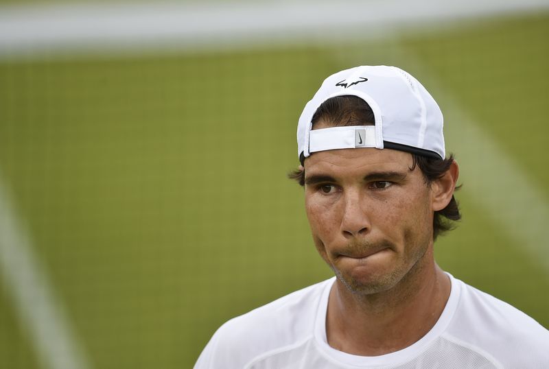 © Reuters. Nadal of Spain practices at Wimbledon in London