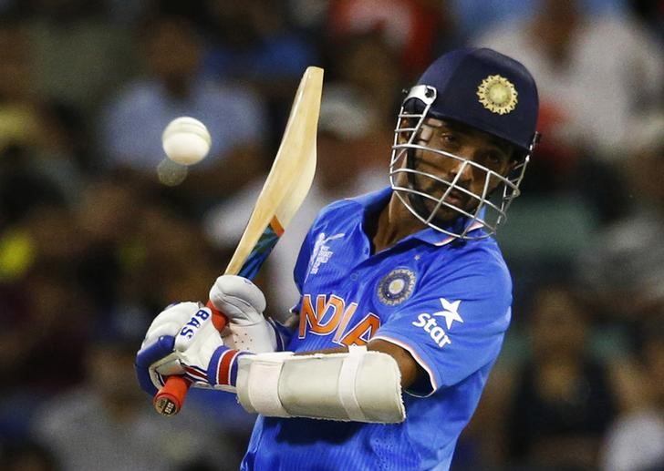 © Reuters. India's batsman Ajinkya Rahane avoids a bouncer from West Indies bowler Andre Russell during their Cricket World Cup match in Perth