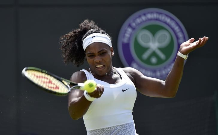 © Reuters. Serena Williams of U.S.A. plays a shot during her match against Margarita Gasparyan of Russia at the Wimbledon Tennis Championships in London