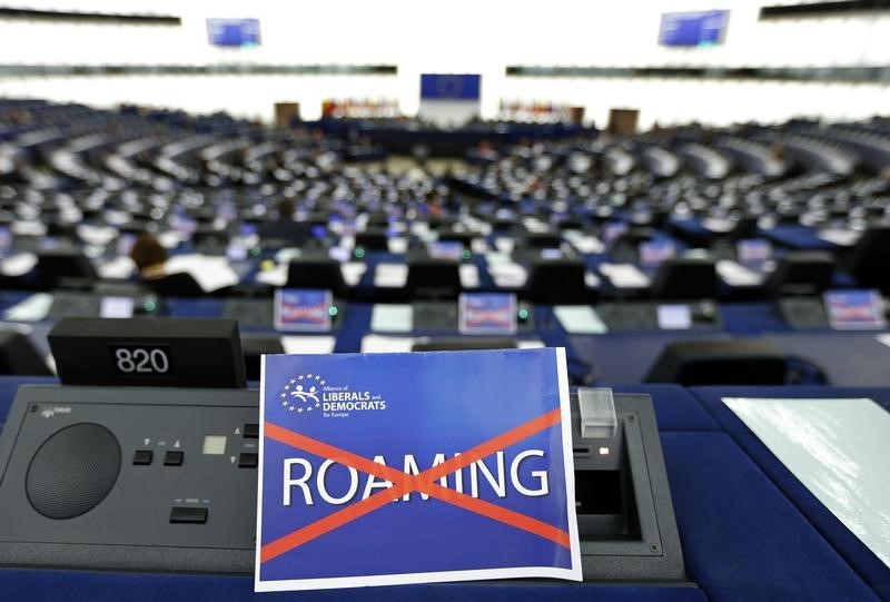 © Reuters. A paper with the word "Roaming", crossed out, is seen on the desk of a Member of the European Parliament during a debate in Strasbourg