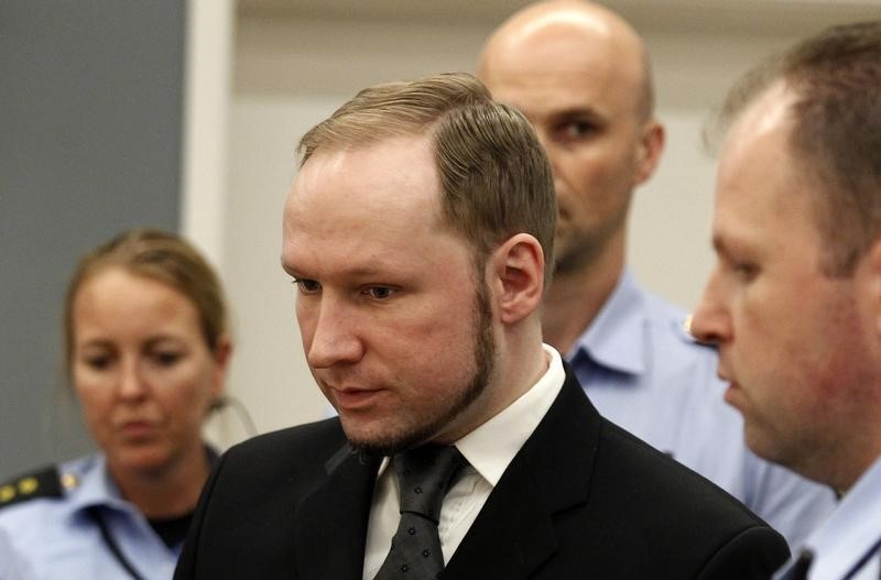 © Reuters. Norwegian mass killer Breivik reacts as he returns after a break to the court room, in Oslo Courthouse