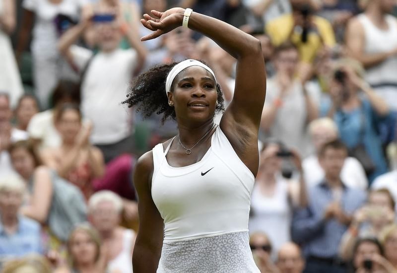 © Reuters. Serena Williams of the U.S.A. celebrates after winning her match against Timea Babos of Hungary at the Wimbledon Tennis Championships in London