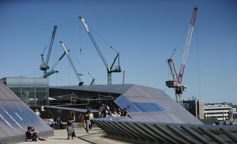 © Reuters. Construction cranes are seen from the roof terrace of One New Change in London