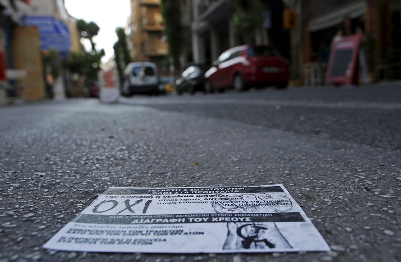 © Reuters. A leaflet showing the word 'No' in Greek is seen left on the pavement in Athens