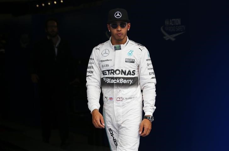 © Reuters. Mercedes Formula One driver Hamilton of Britain reacts after taking the pole position in the qualifying session for the Austrian F1 Grand Prix in Spielberg