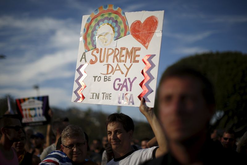 © Reuters. Steve Ledoux, 55, and his husband Mark Becktold, 53, who married in 2008, celebrate at a rally in West Hollywood