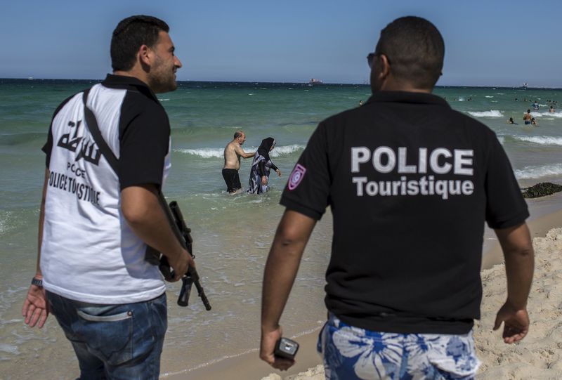 © Reuters. Tourist police officers patrol at the beach  in Sousse,