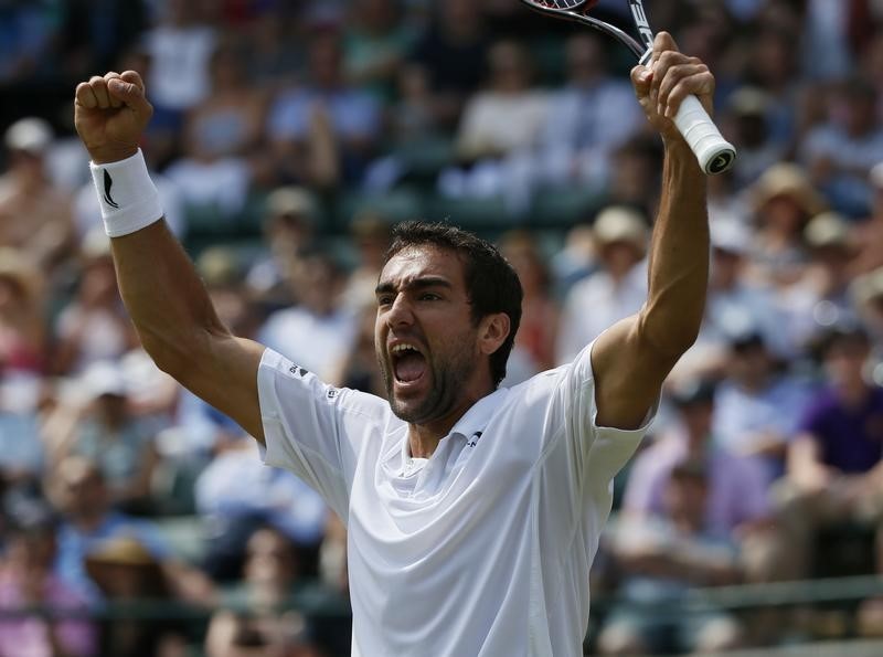 © Reuters. Marin Cilic of Croatia celebrates after winning his match against John Isner of the U.S.A. at the Wimbledon Tennis Championships in London