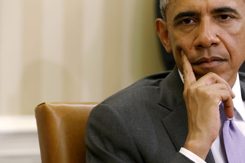 © Reuters. Obama listens to remarks to reporters by Trong after their meeting in the Oval Office at the White House in Washington