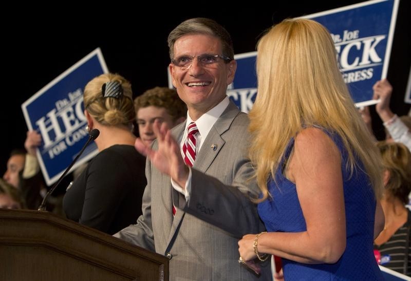 © Reuters. U. S. Rep. Heck (R-NV) arrives to thank supporters, after defeating Democrat challenger Oceguera, during a Republican election night party at the Venetian Resort in Las Vegas