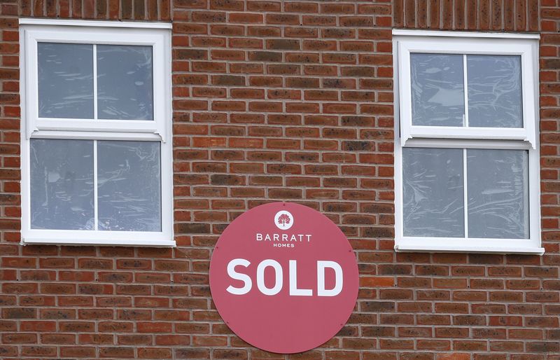 © Reuters. File photo of a sold sign hanging on a new house on a Barratt Homes building site in Nuneaton