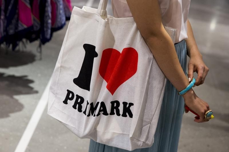 © Reuters. An invited guest stands in a store of clothing retailer Primark before its opening in Berlin