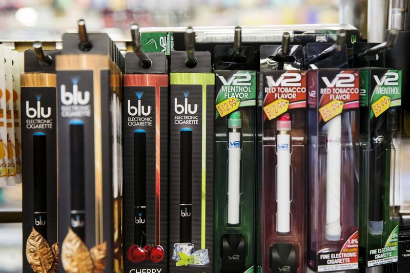 © Reuters. E-cigarettes hang displayed in a tobacco shop in New York