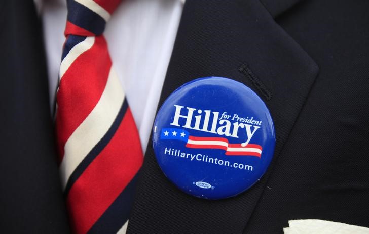 © Reuters. A campaign button is shown as U.S. Democratic presidential candidate Hillary Clinton delivers her "official launch speech" at a campaign kick off rally in Franklin D. Roosevelt Four Freedoms Park on Roosevelt Island in New York City
