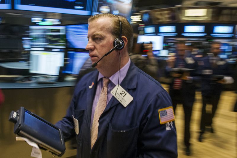 © Reuters. A trader works shortly after the opening bell on the floor of the New York Stock Exchange