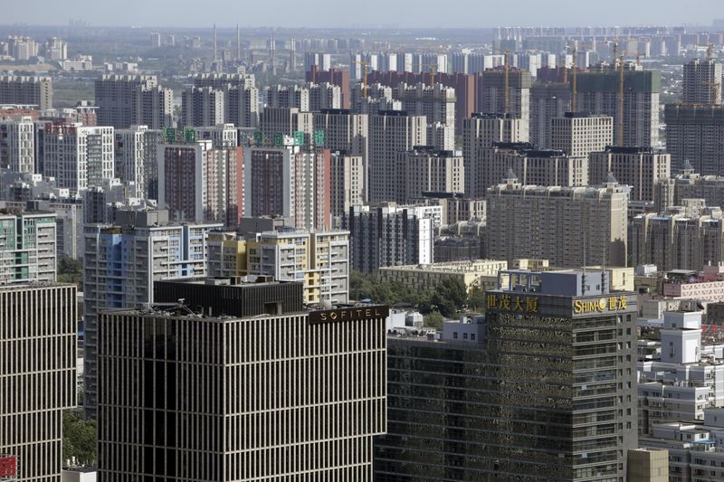 © Reuters. Apartment blocks and office buildings are pictured in Beijing