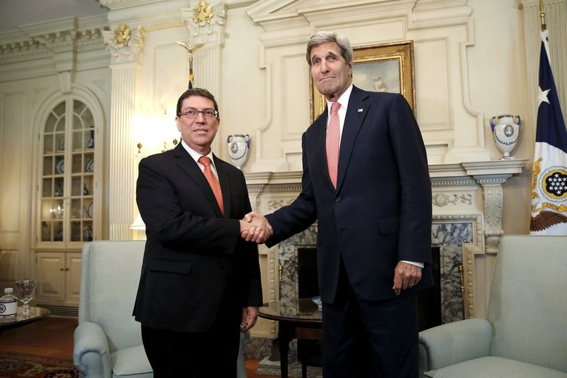 © Reuters. Kerry welcomes Rodriguez to his office at the State Department in Washington